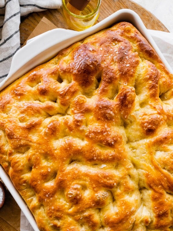 no-knead focaccia in a pan after it is done baking.