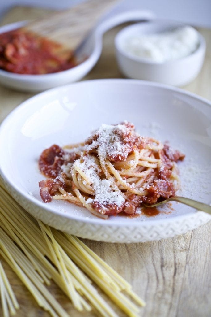 Spaghetti in a white bowl.