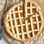 Whole crostata with a slice taken out