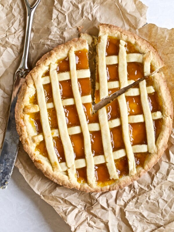 Whole crostata with a slice taken out