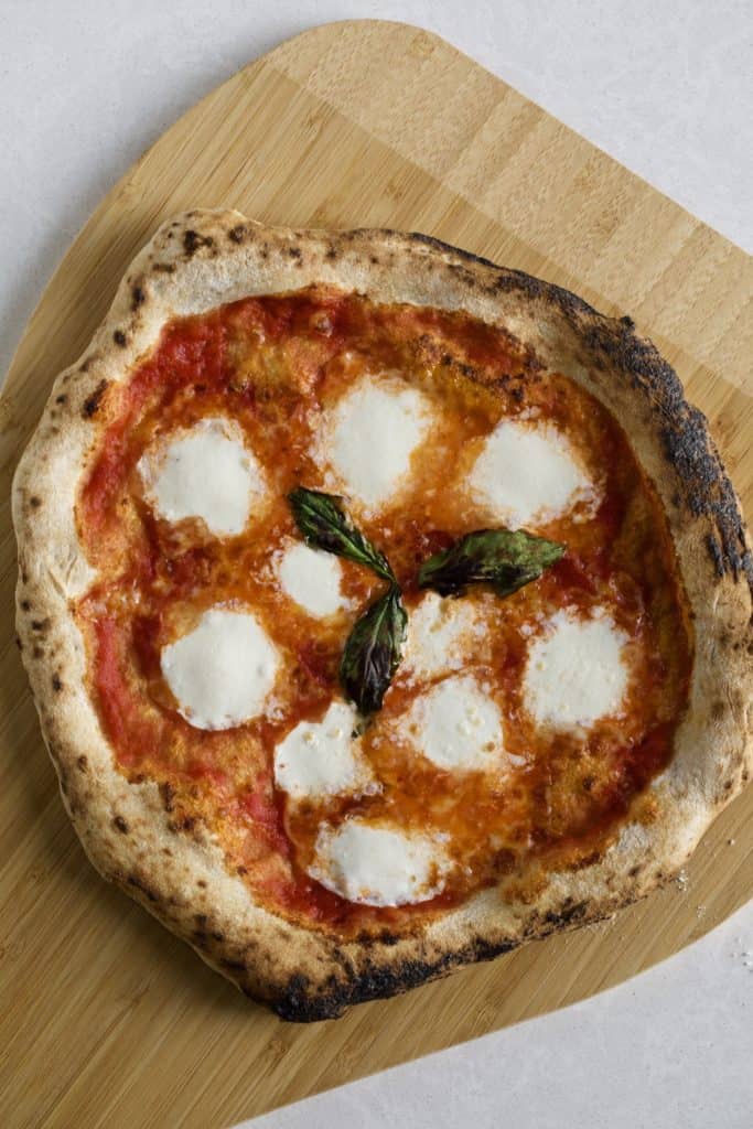 pizza napoletana (Neapolitan) on a wood board