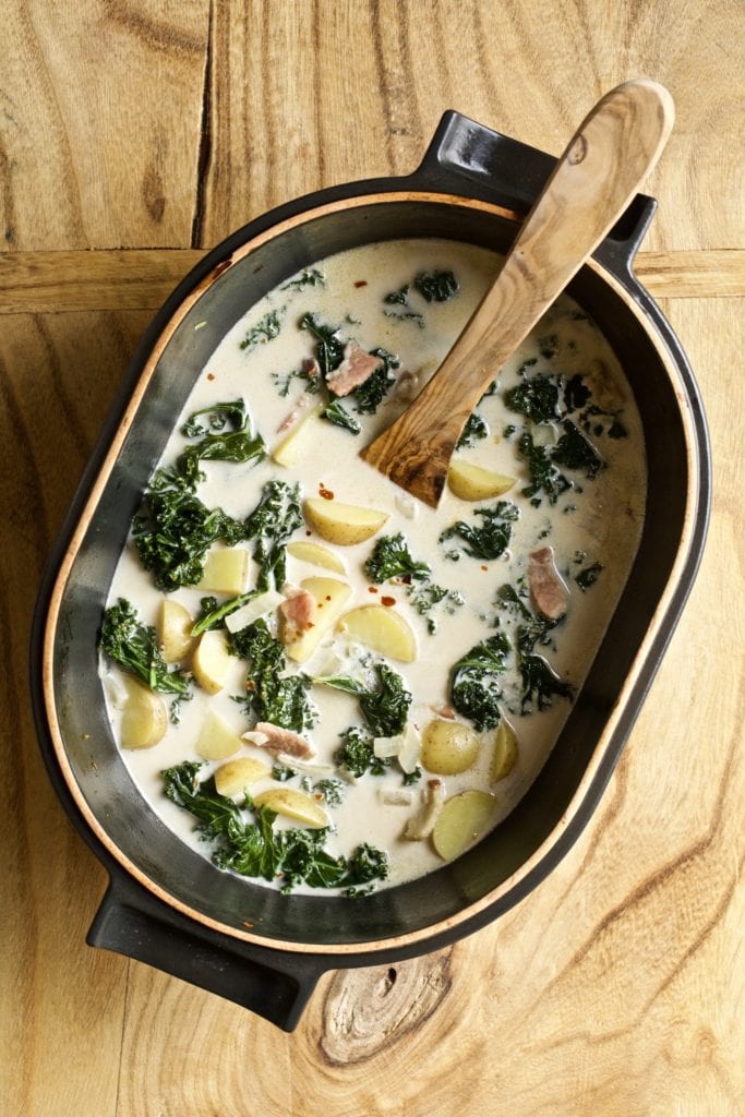pot of soup with kale, cream, potatoes, in a cream based sauce