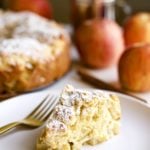 Slice of Italian apple cake on a plate with a fork.