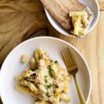 creamy sausage baked ziti on a plate with a fork
