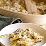 creamy sausage baked ziti on a plate with a fork