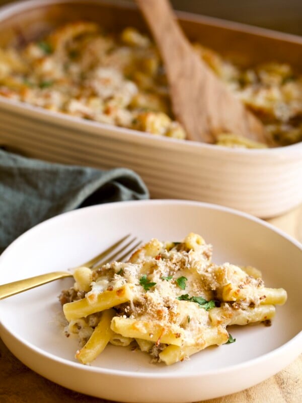 creamy sausage baked ziti on a plate with a fork