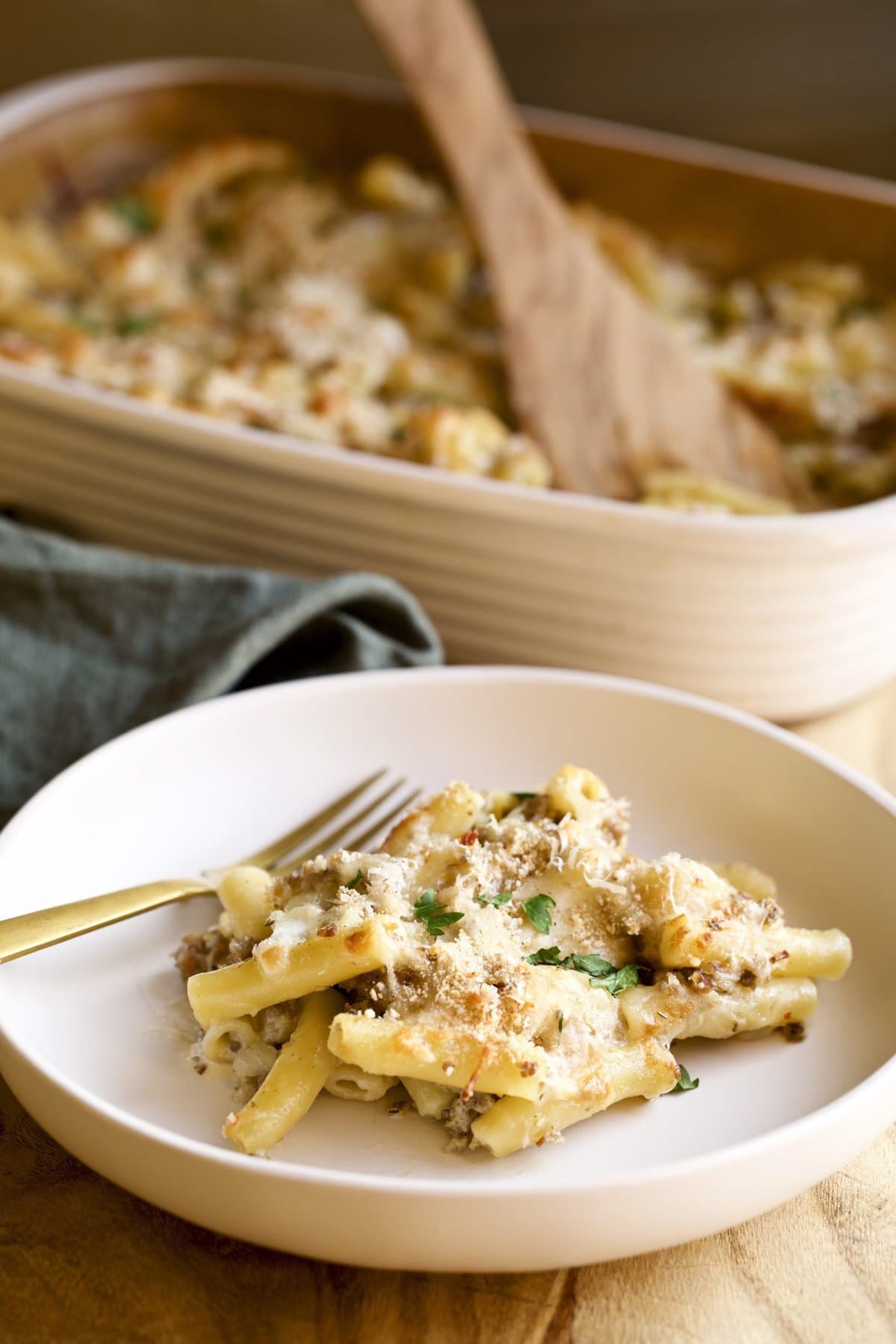 creamy sausage baked ziti on a plate with a fork