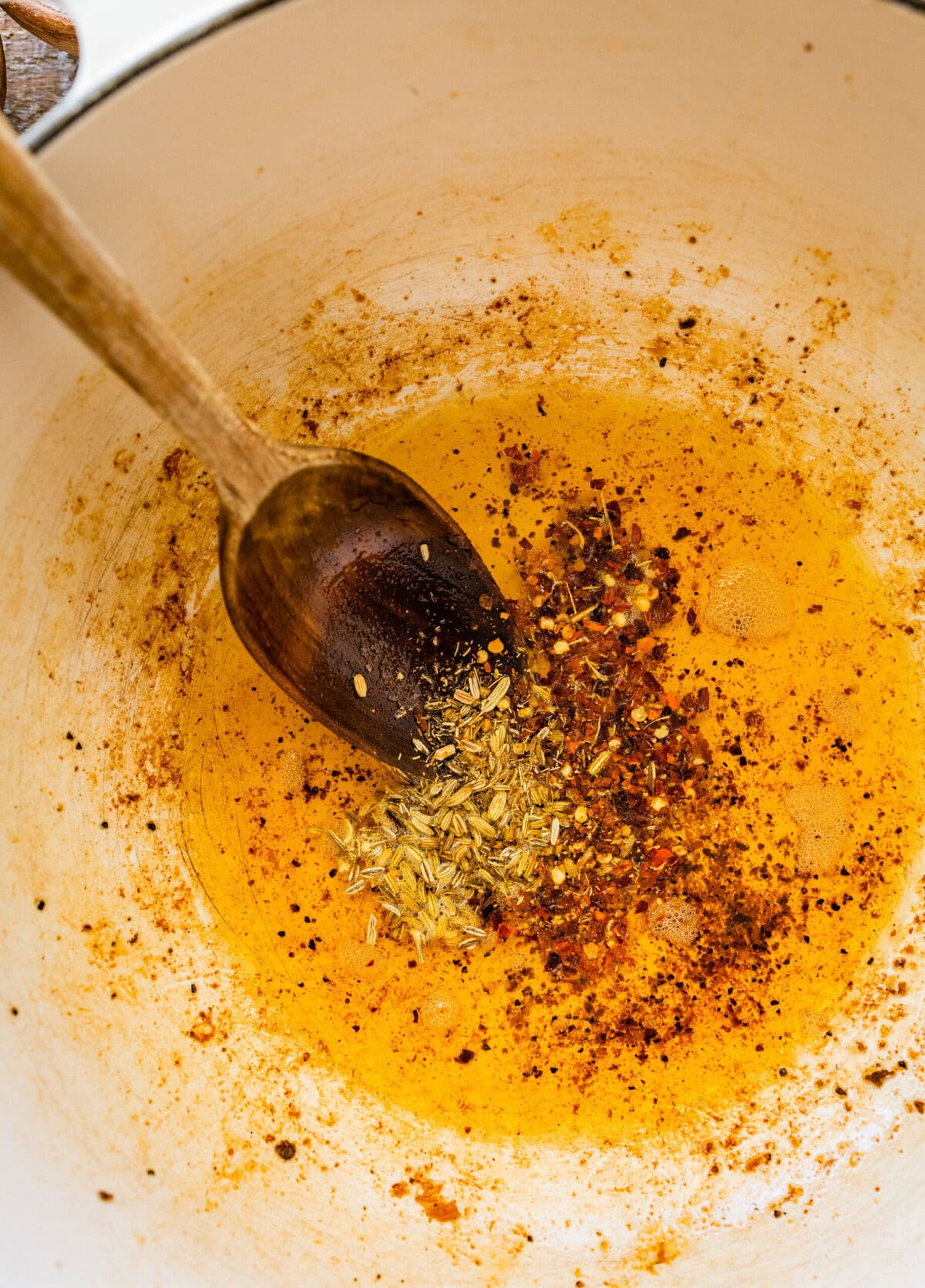 The seasonings and garlic added to the pot to cook. 