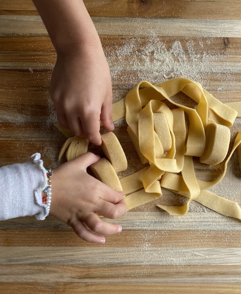 homemade pappardelle pasta kids hands