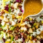 pour the orange vinaigrette salad dressing over the pear gorgonzola salad.