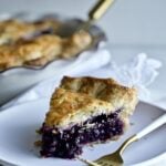 Best Bursting Blueberry Pie Frozen Berries slice on a plate