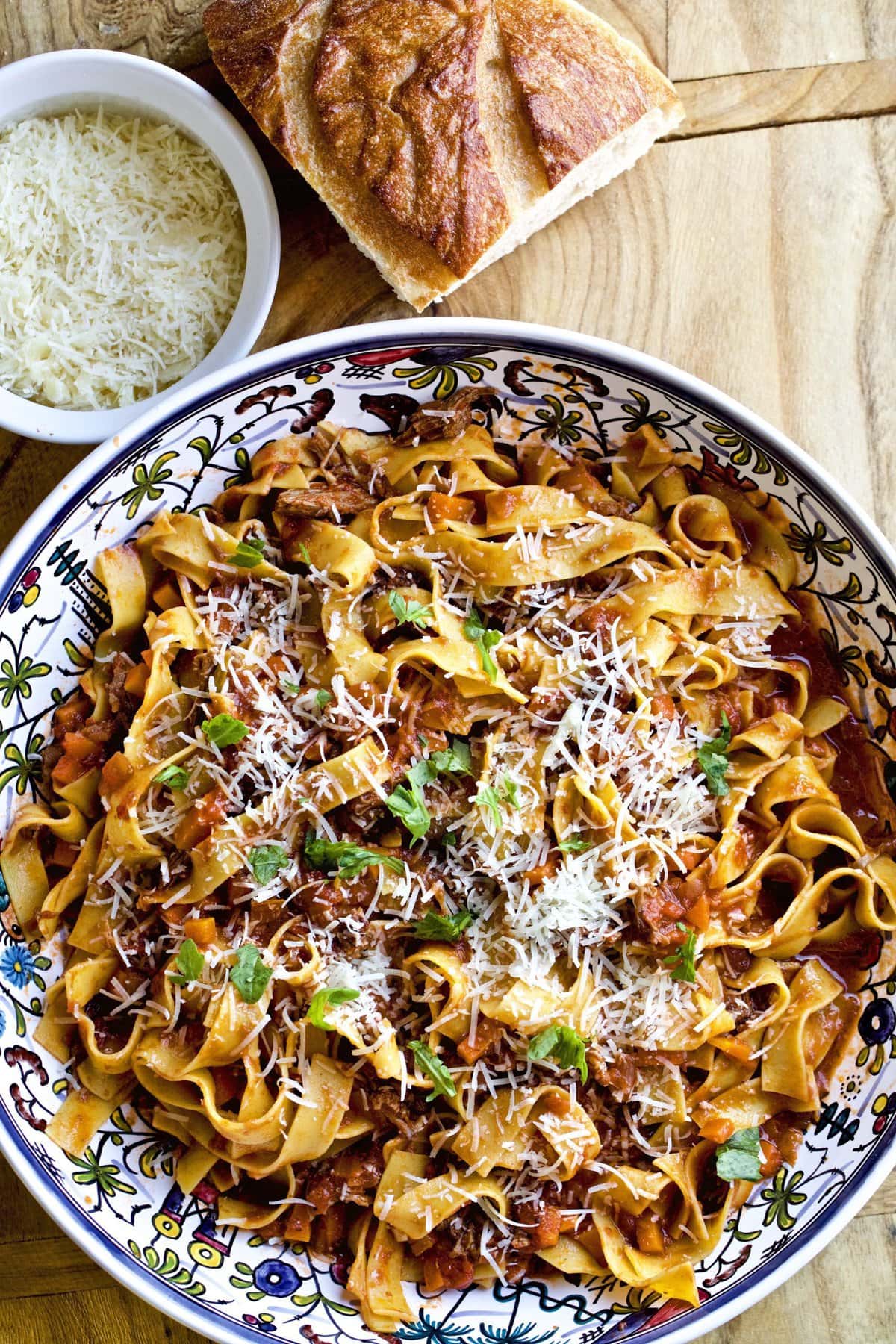 Floral bowl of Italian beef short rib ragu and pasta.