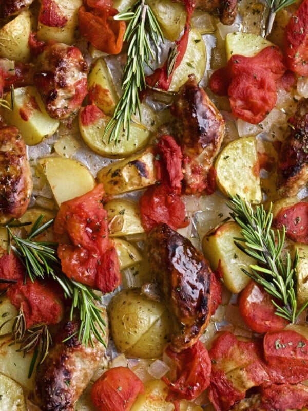 close up of oven roasted Italian sausage potatoes and tomatoes