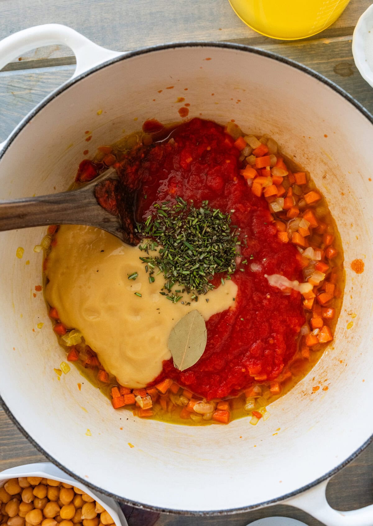 The remaining ingredients added to the pot, resting on top of the soup before stirring.