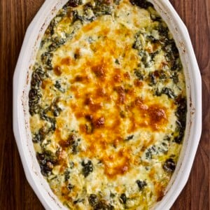 Hot mascarpone spinach and artichoke dip in a platter