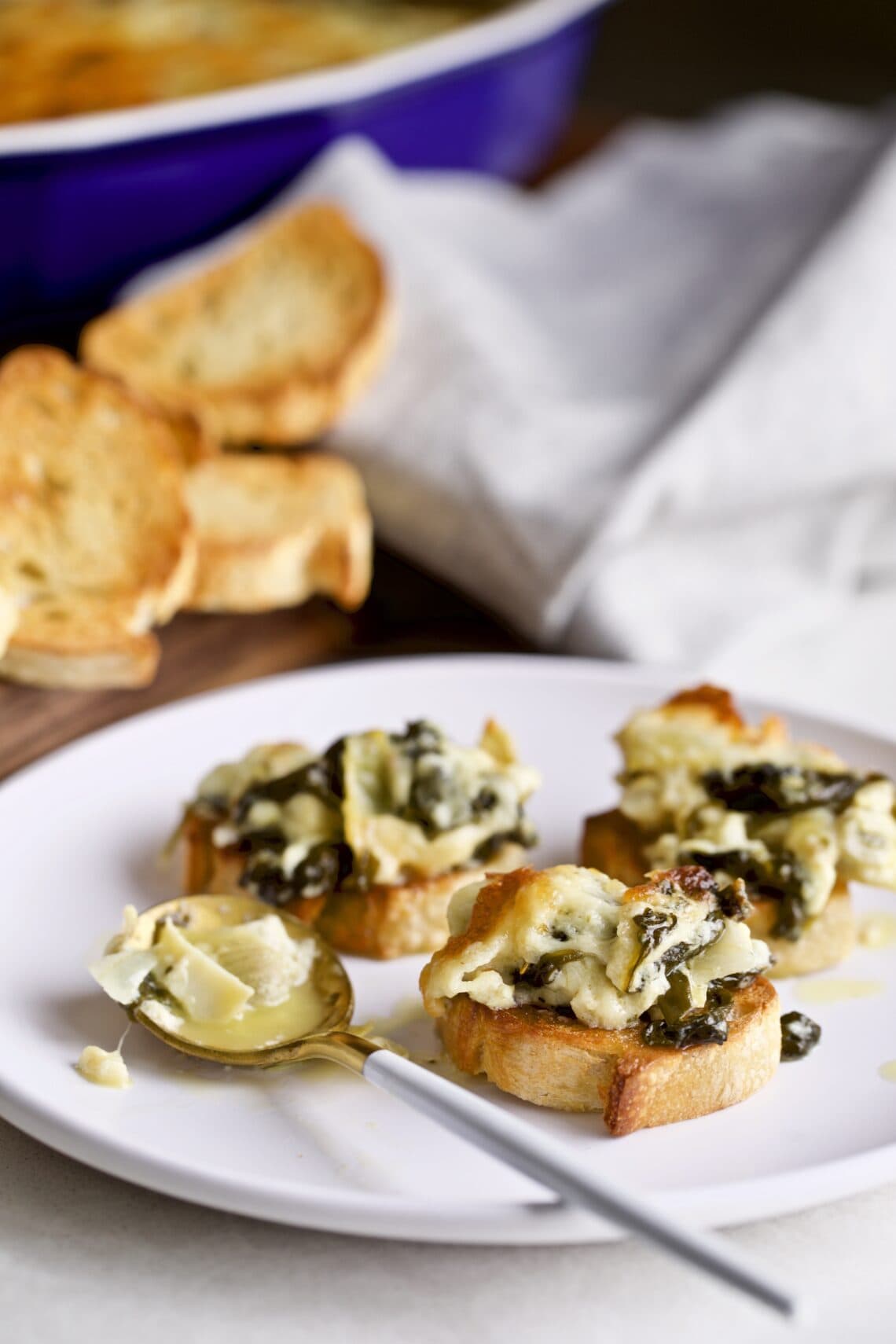 Hot mascarpone spinach and artichoke dip served on bread