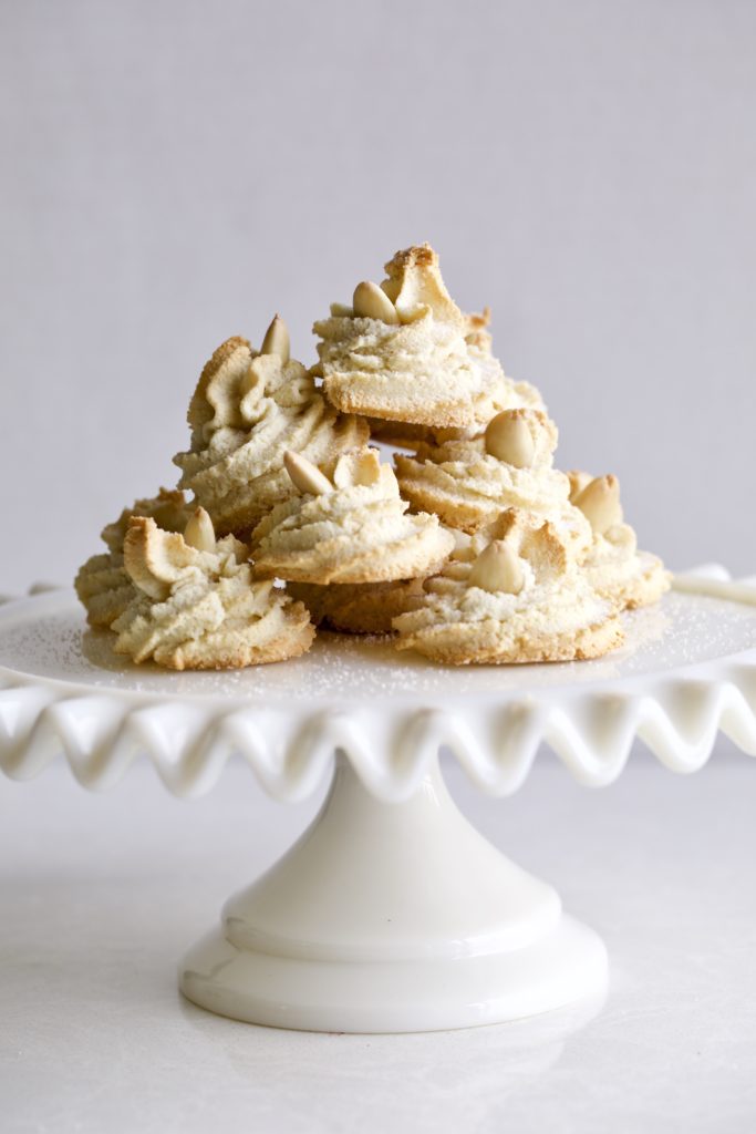 Soft Amaretti Cookies Italian Almond Cookies on a cake plate 