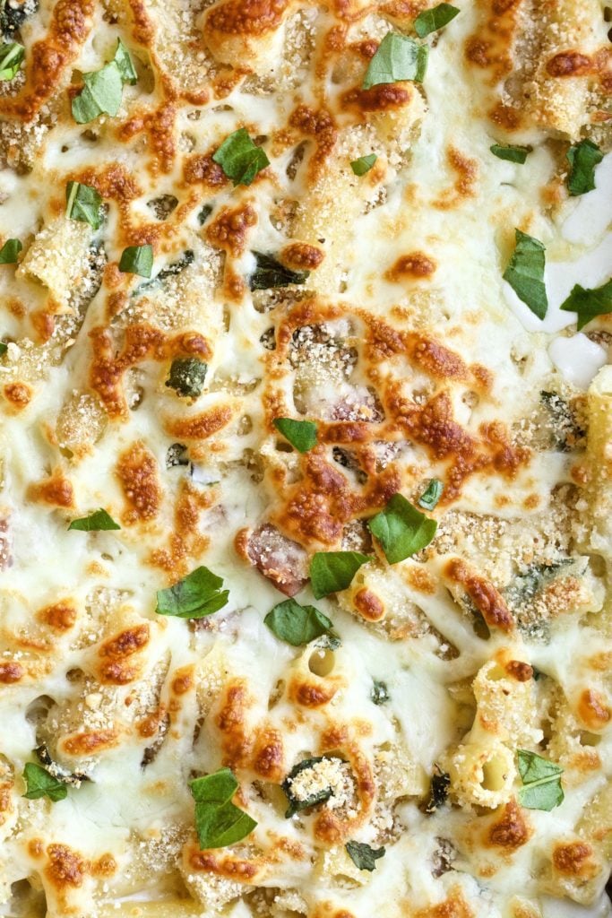 Baked Bechamel ham and cheese pasta close up in pan