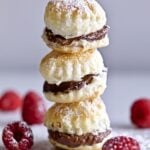 chocolate cream puffs with raspberries on the side