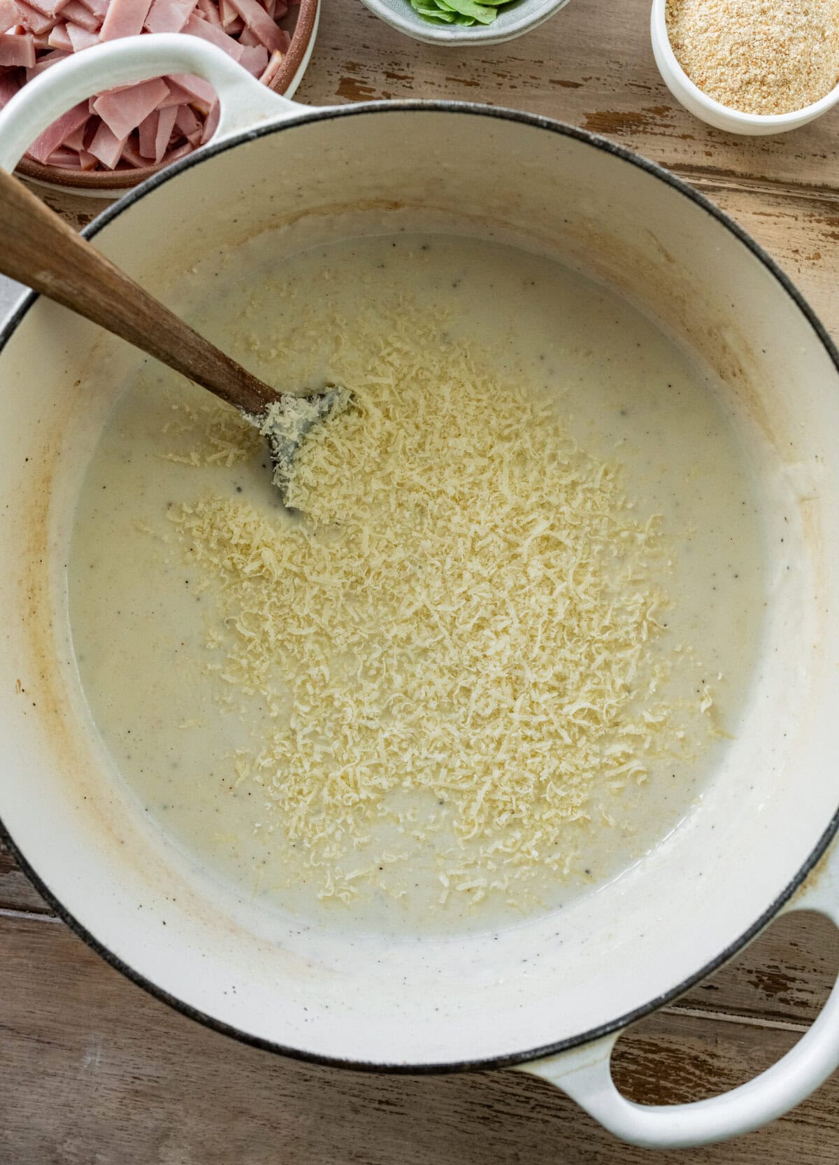 Parmesan cheese added to the pot.