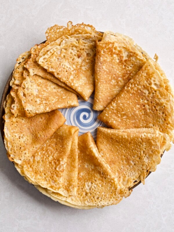 Ring of Swedish pancakes on a plate.