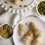 Cream horns on a white plate.