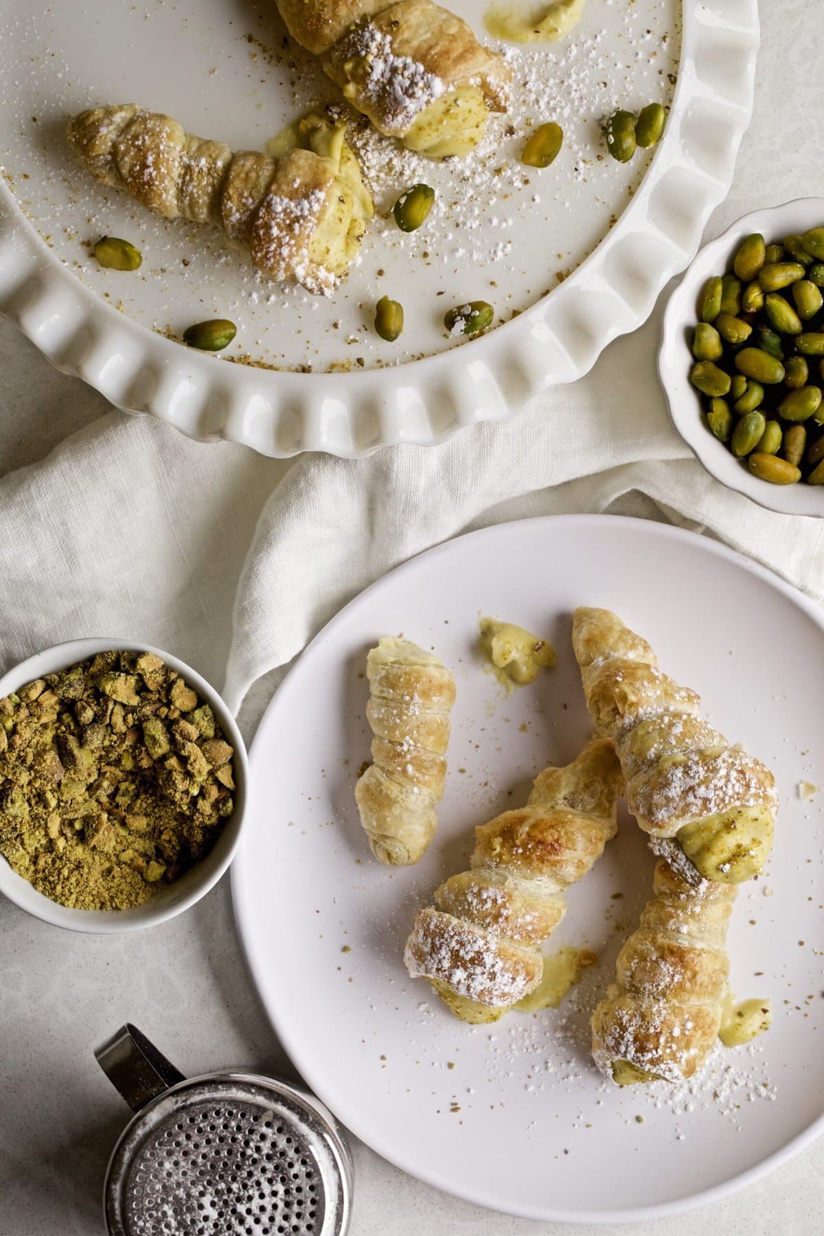 Cream horns on a white plate.