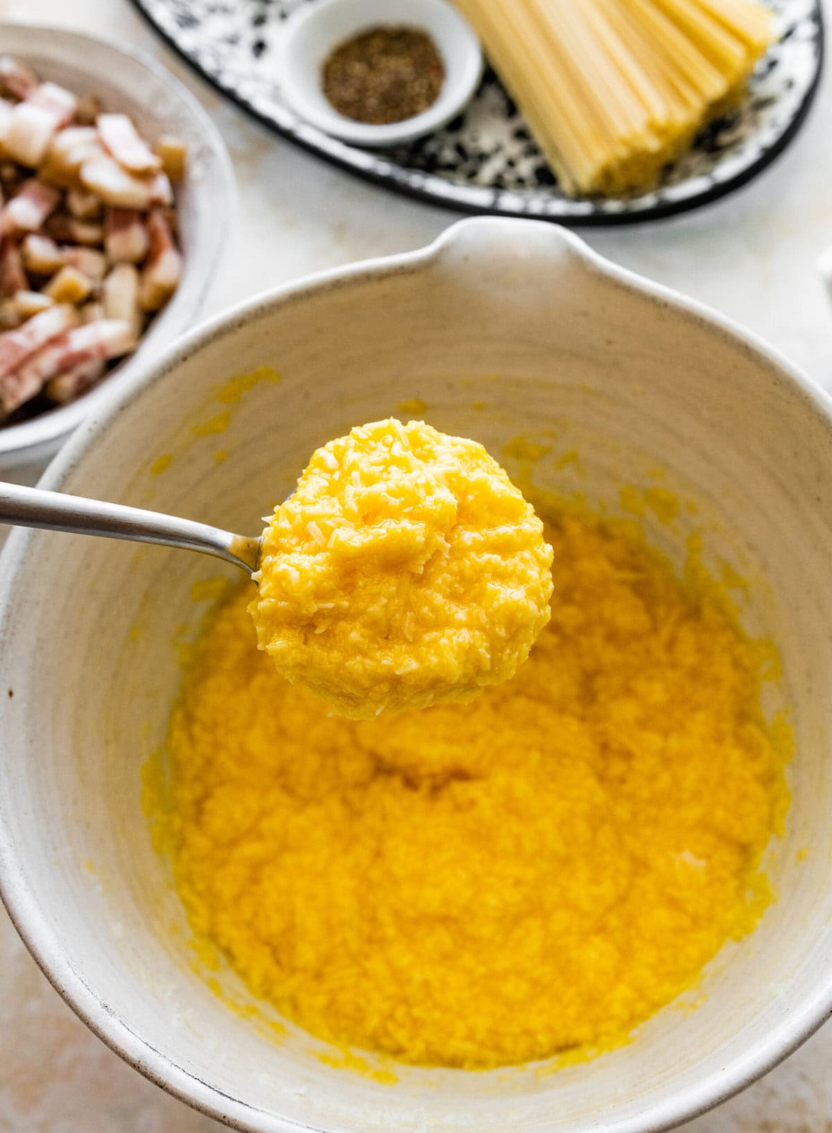 Parmesan added and mixed with the egg.