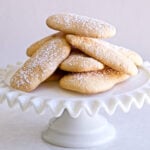 Homemade Italian ladyfingers also called savoiardi on a cake plate.