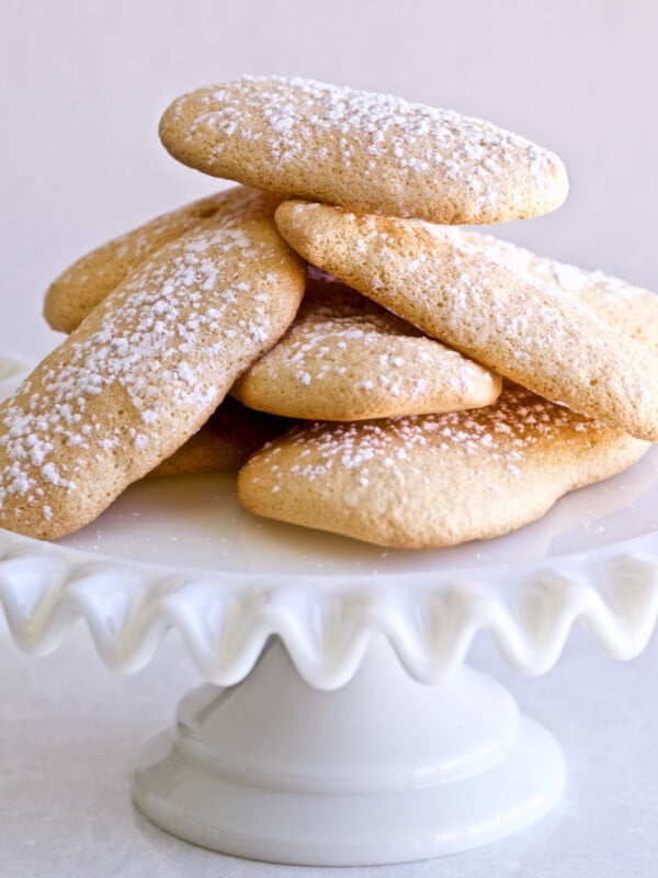 Homemade Italian Ladyfinger Recipe (Savoiardi) on a cake plate.