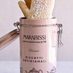Homemade Italian Ladyfinger Recipe (Savoiardi) in a pink tin cookie canister