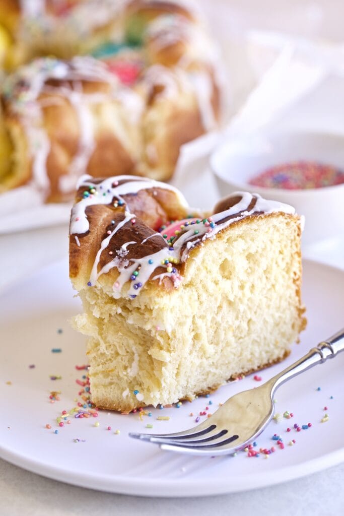 Slice of Easter bread on a plate with a fork.