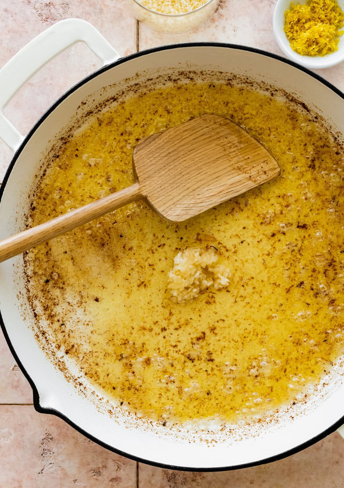 Garlic added to the skillet with more butter.