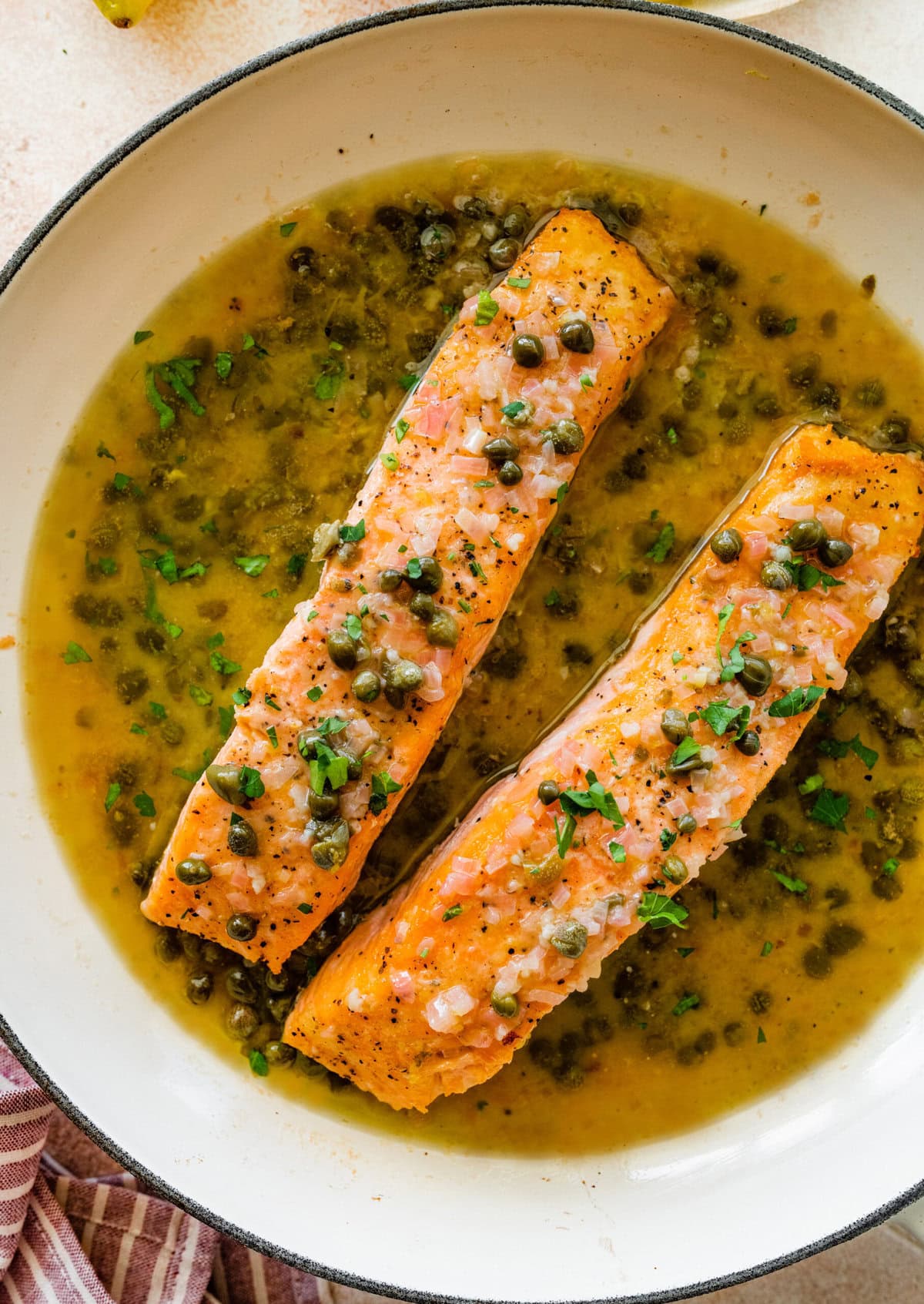 Salmon added to the skillet with the sauce.