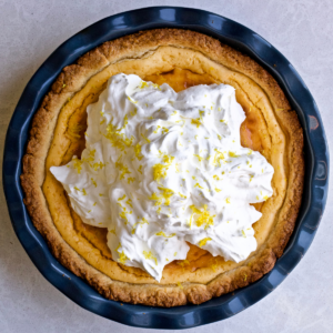 Best Italian Ricotta Pie Recipe (Easter) with whipped cream in a beautiful pie dish