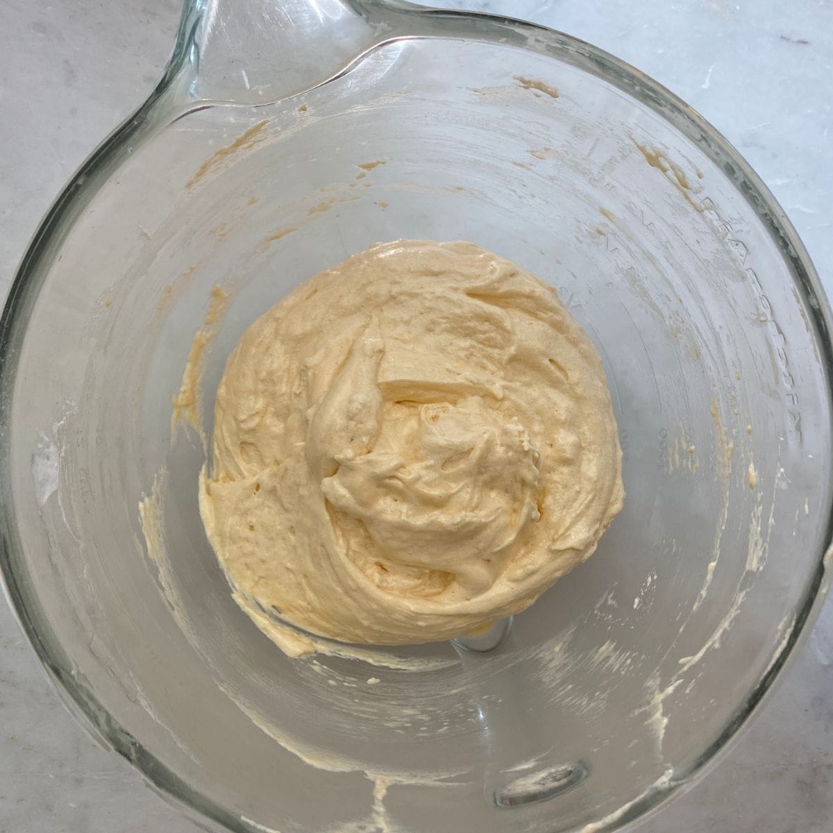 Ladyfinger batter mixed in a bowl. 
