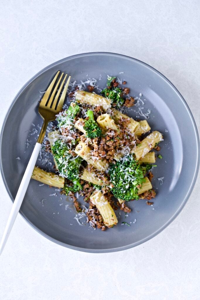 Broccoli Pasta with Sausage Recipe (Italian)- on a plate with a fork. 