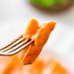 bite of pink sauce pasta on a fork.