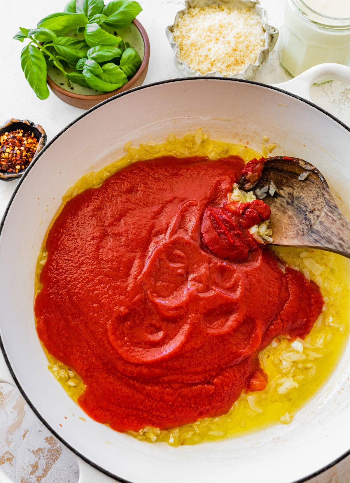 Add the tomato passata to pan with onions.