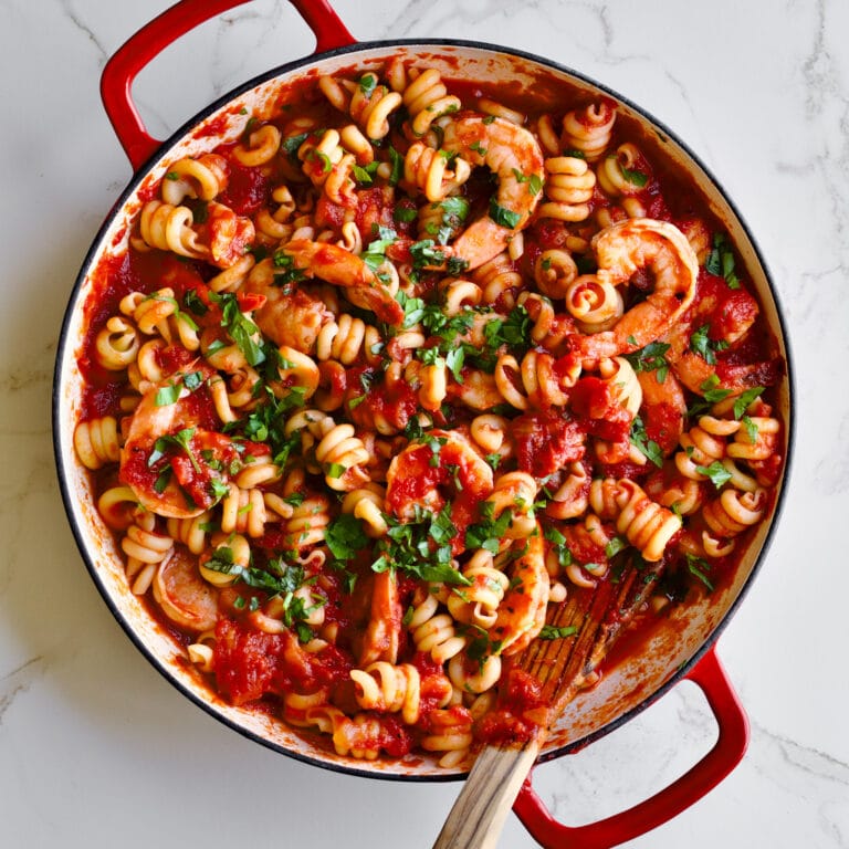 Trottole Pasta Recipe with Tomato Sauce and Shrimp in red enamel pan