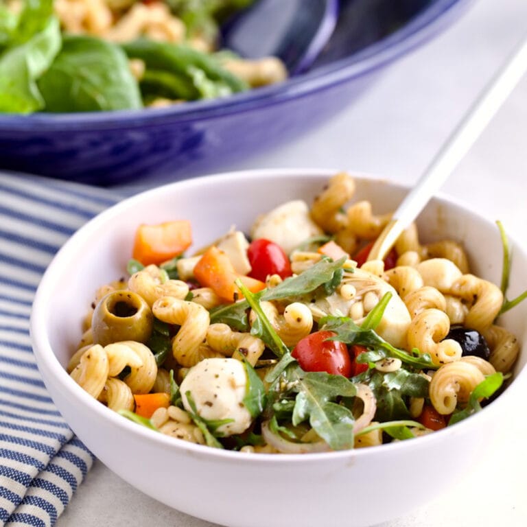 Antipasto Pasta Salad Recipe (with Italian Dressing) in a bowl with a fork.