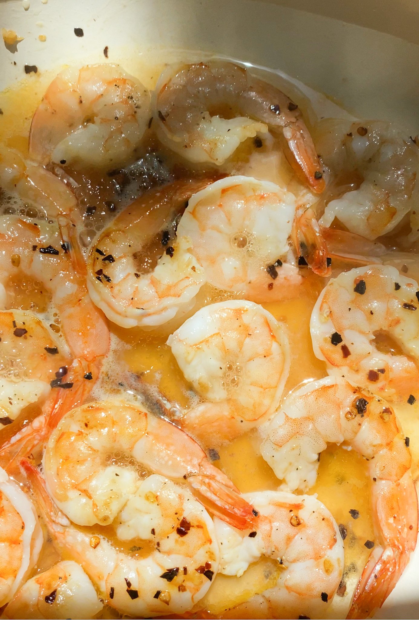 shrimp cooking in garlic and wine