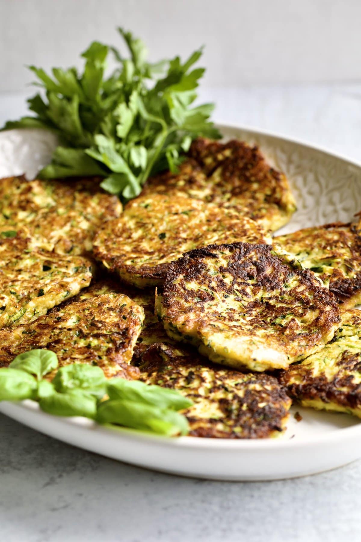 Best Italian Zucchini Fritters (easy recipe) on a platter for serving.