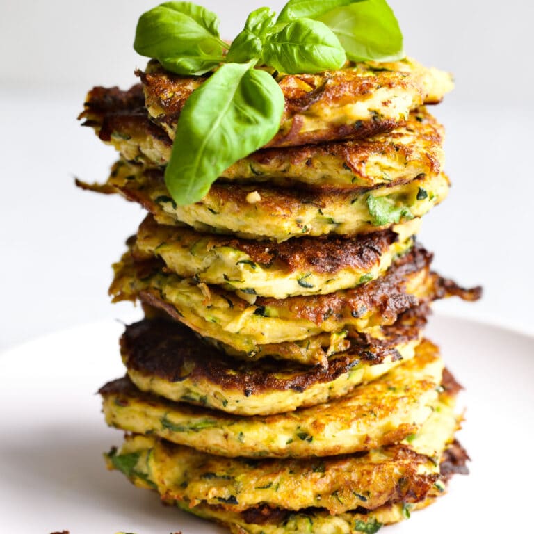 stack of zucchini fritters on a plate