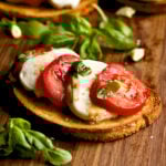 close up of bruschetta bread with mozzarella and tomato.