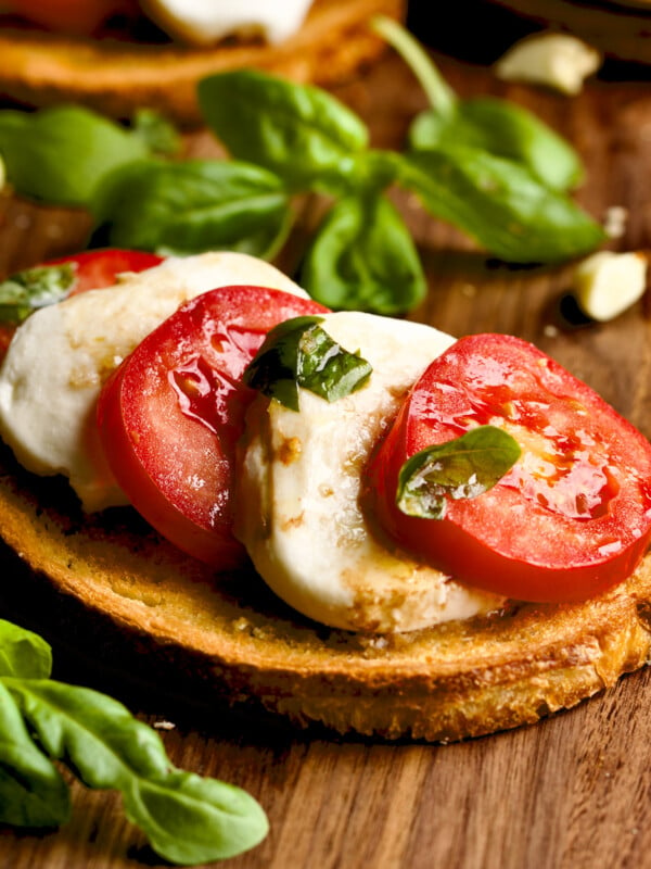 close up of bruschetta bread with mozzarella and tomato.