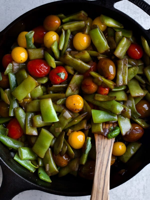 Italian green beans and tomatoes cooked in cast iron pan