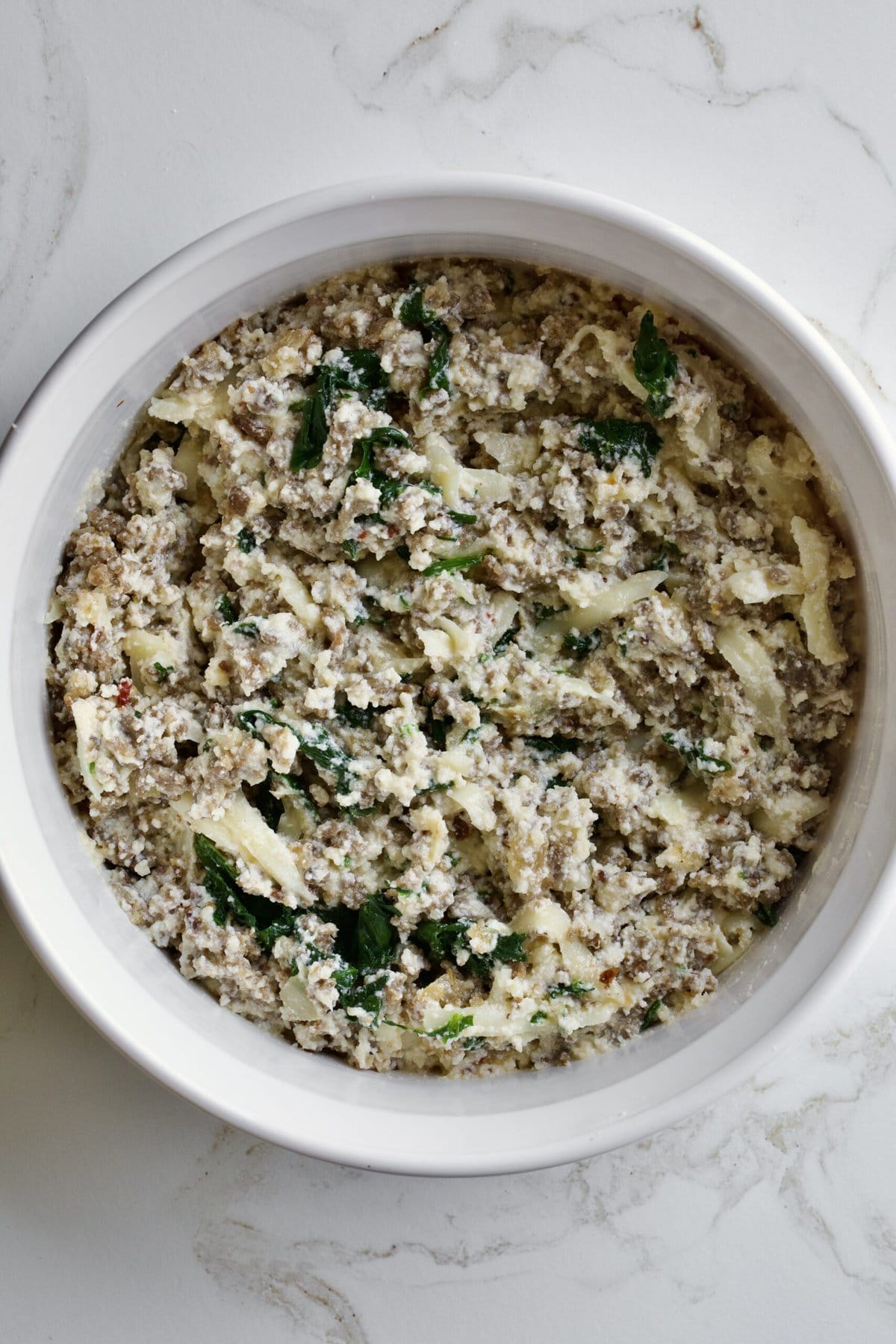 sausage and cheese mixture for filling the pasta shells.