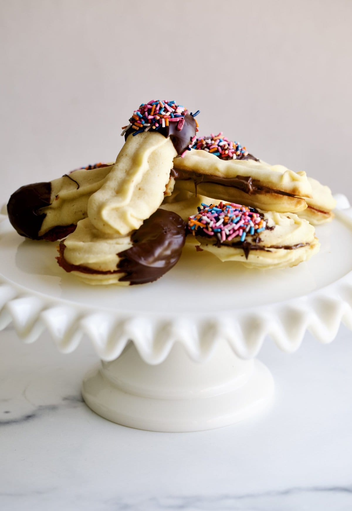 Italian butter cookies on a cake platter.