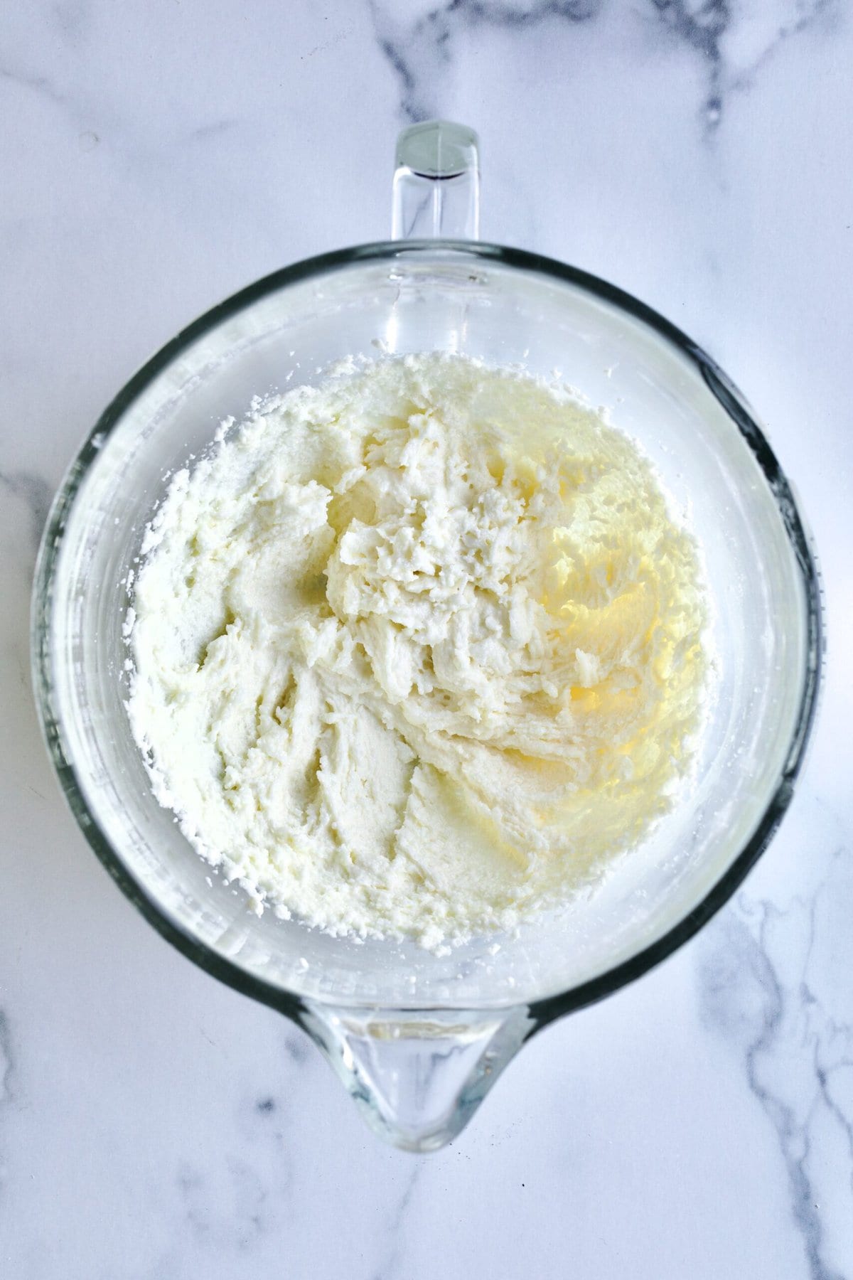 how to make Italian lemon ricotta cookies- whipping butter and sugar.
